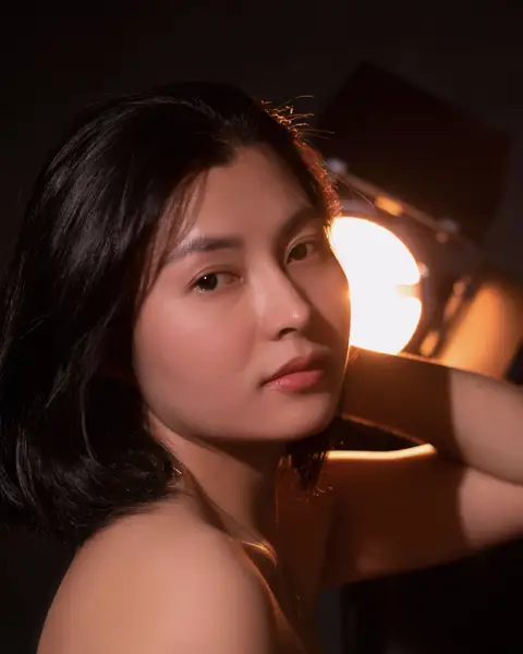 Sample frame: Woman in warm lamp light